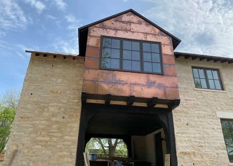 Copper metal panel facade on a stone building for Skylight Installation in Robbinsville